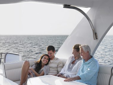 Couples relaxing on yacht