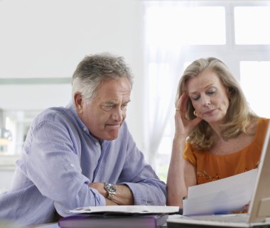 Couple looking at bills