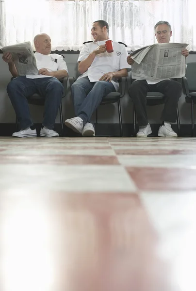 Three barbers waiting — Stock Photo, Image