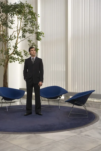 Businessman standing in office — Stock Photo, Image