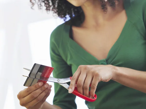 Woman cutting credit card — Stock Photo, Image