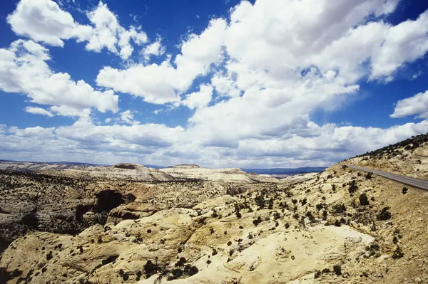 Cloudscape above rocky landscape — Stock Photo, Image