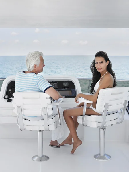 Man and young woman sitting — Stock Photo, Image