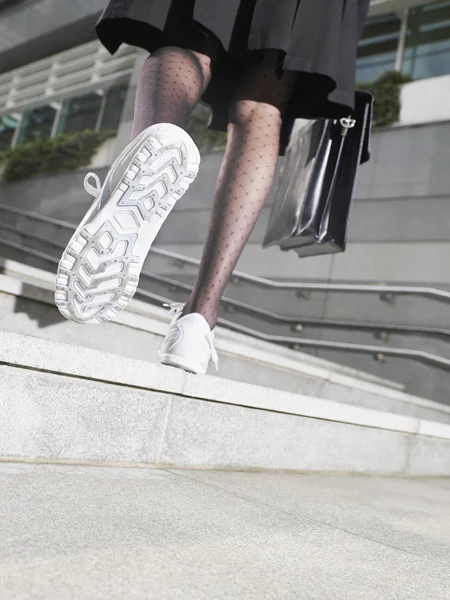 Business woman wearing running shoes — Stock Photo, Image