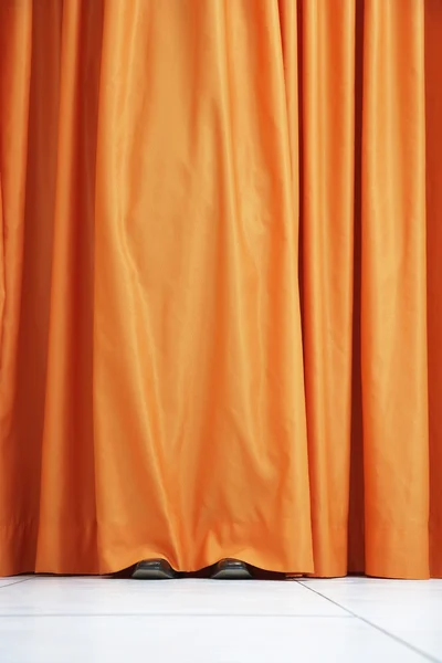 Person hiding behind curtain — Stock Photo, Image
