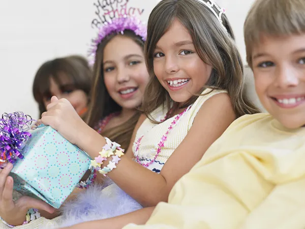 Children sitting in row — Stock Photo, Image