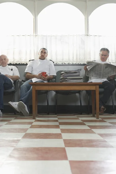 Three barbers waiting — Stock Photo, Image