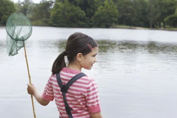 Girl with fishing net — Stock Photo, Image