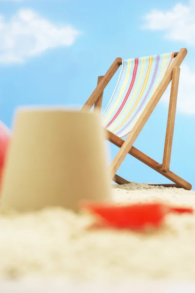 Deck chair behind castle — Stock Photo, Image