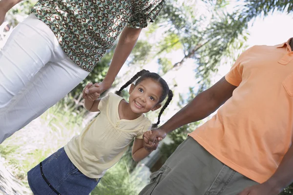 Parents walking with daughter — Stock Photo, Image