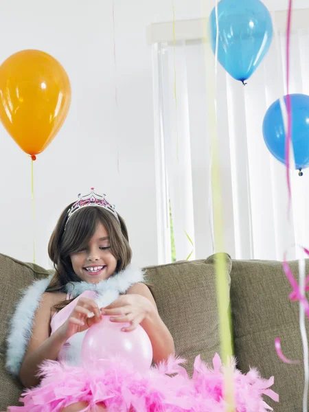 Girl preparing birthday balloons — Stock Photo, Image