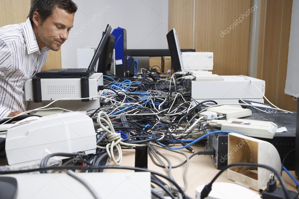 Man Working on Computer Hardware