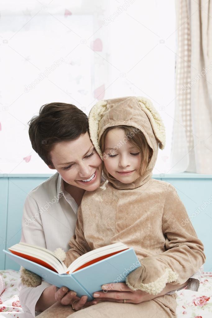 Mother and daughter reading book