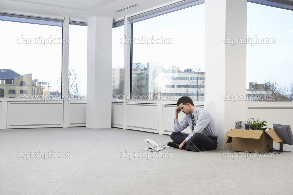 Office worker sitting on floor