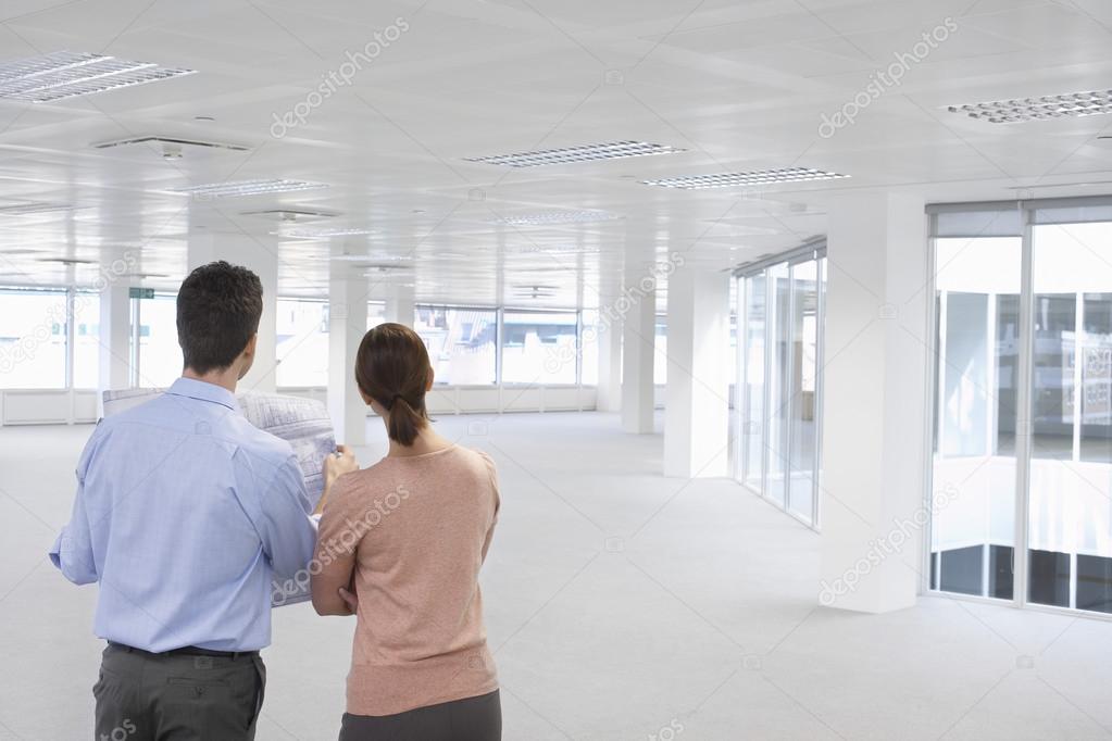 Office workers looking at empty office