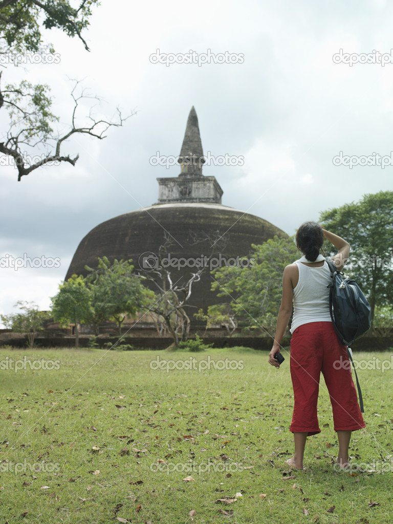 Woman looking at stupa