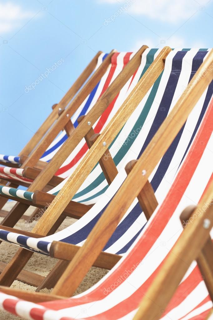 folding deck chairs on beach