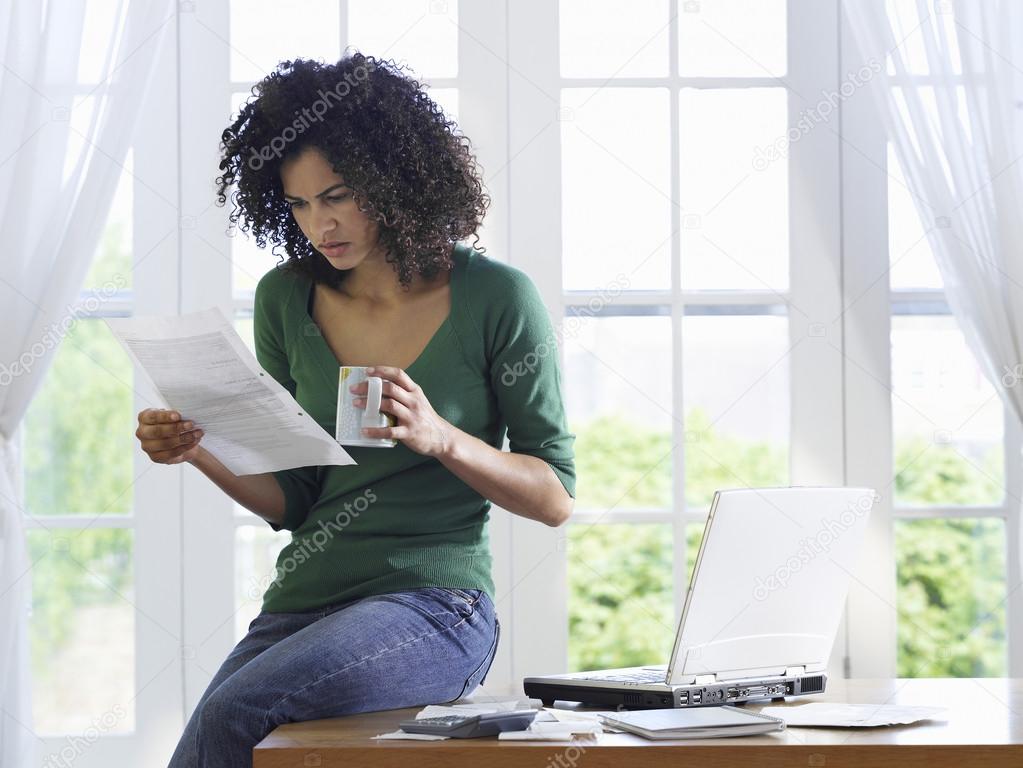 Woman reading paper document