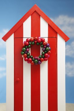 Beach cabin with christmas decoration clipart