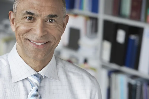 Business man standing in office — Stock Photo, Image