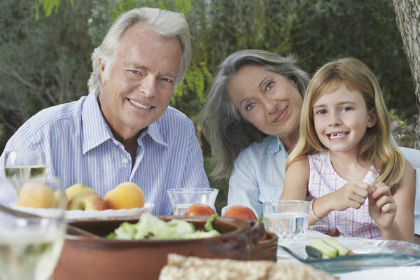 Grandparents sitting at table
