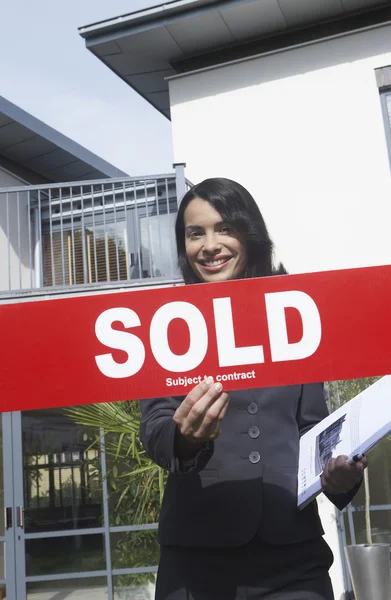 Agent Holding Sold Sign — Stock Photo, Image