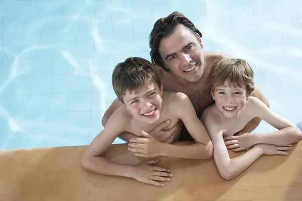 Father embracing two sons — Stock Photo, Image