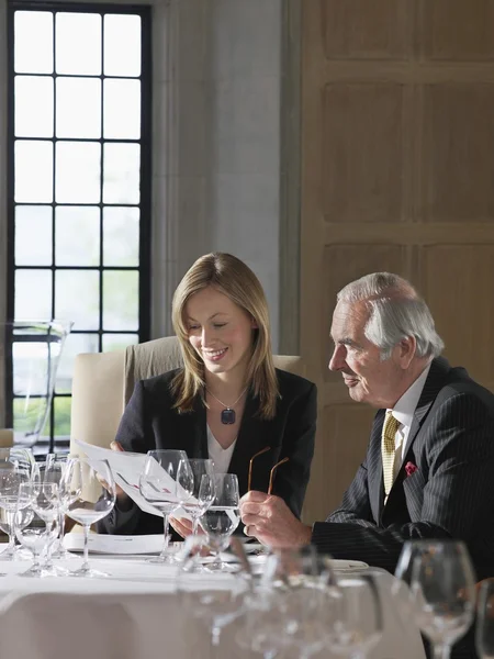 Business man and woman reading documents — Stock Photo, Image