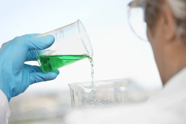 Technician Pouring Blue-green Liquid — Stock Photo, Image