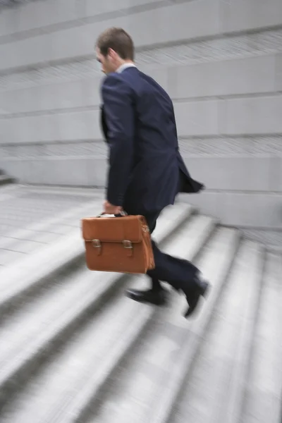 Business man carrying briefcase — Stock Photo, Image