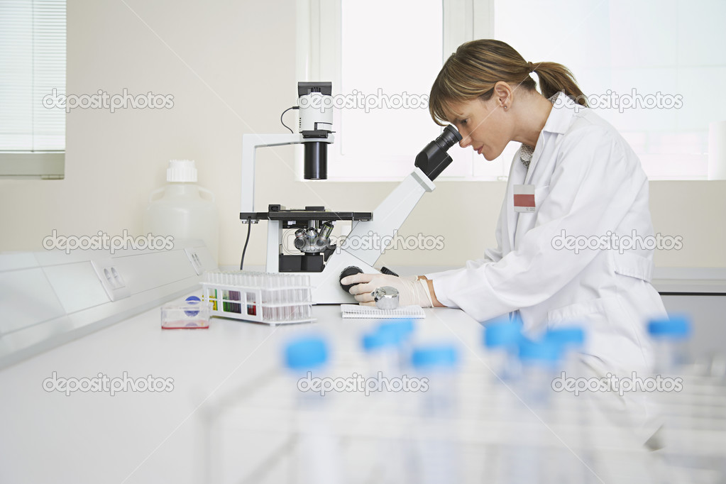Technician Using Microscope