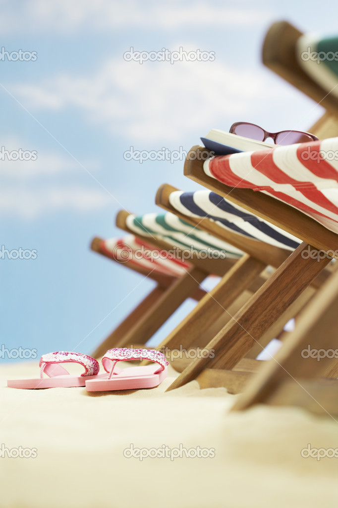 folding deck chairs on beach