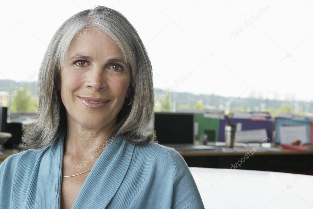 Middle aged businesswoman smiling