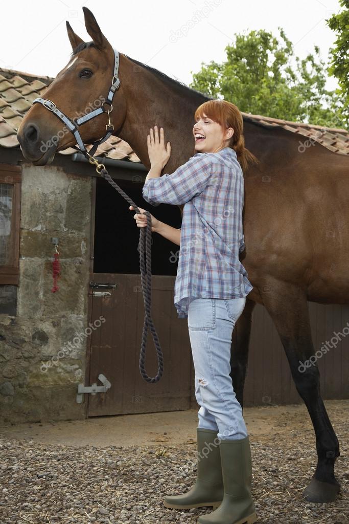 Woman Petting Horse