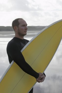 adam tutarak surfboard Beach