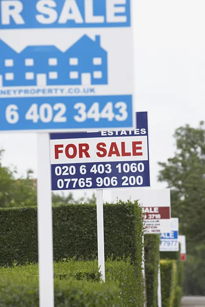 Real estate for sale signs — Stock Photo, Image