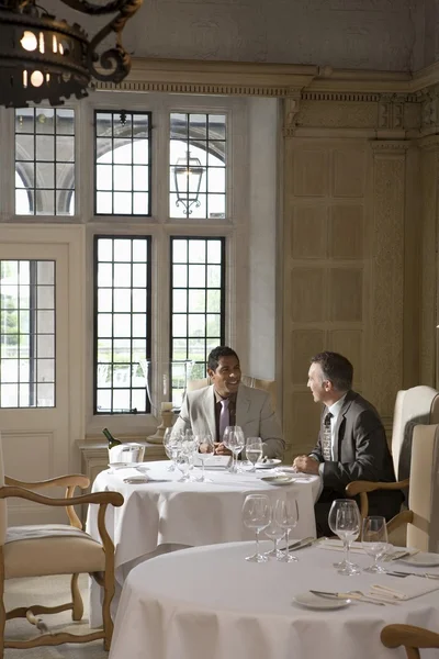 Business men sitting at restaurant — Stock Photo, Image