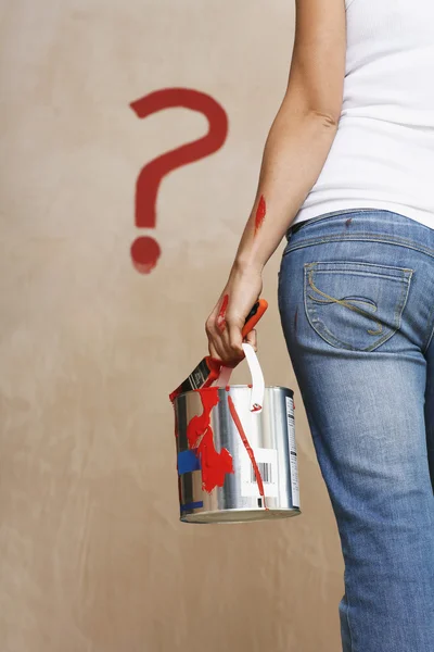 Woman holding painting can and question mark — Stock Photo, Image