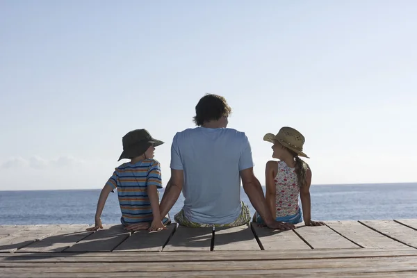 Father and children sitting — Stock Photo, Image