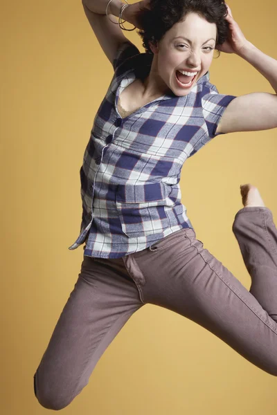 Woman jumping and screaming — Stock Photo, Image