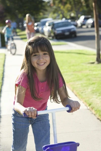 Girl on scooter — Stock Photo, Image