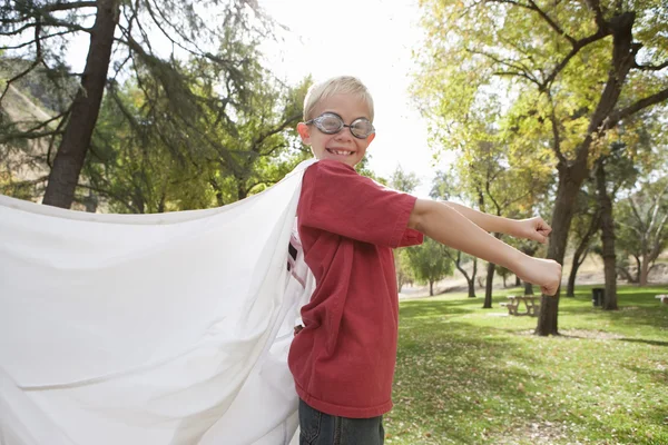 Boy with  cape and swimming goggles — Stock Photo, Image