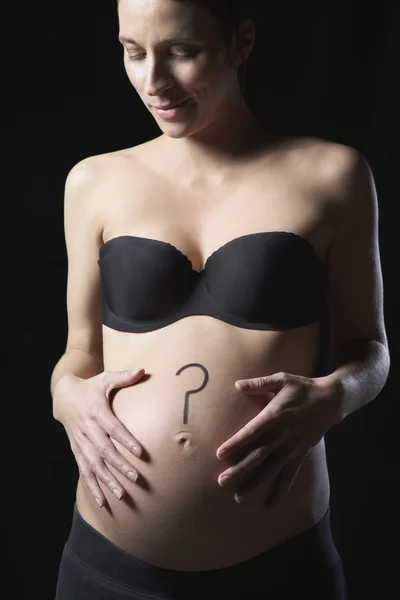 Woman with question mark on abdomen — Stock Photo, Image