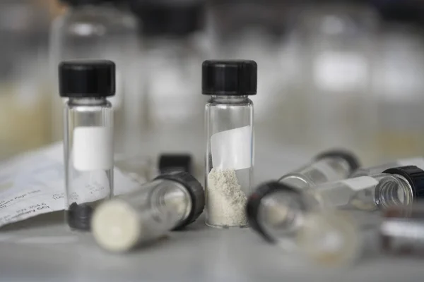 Sample bottles on table top — Stock Photo, Image