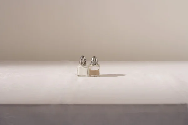 Salt and pepper shakers on table — Stock Photo, Image