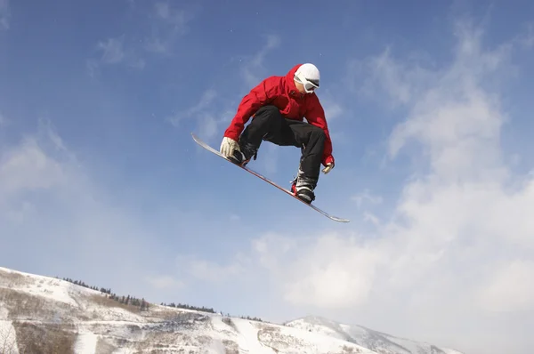 Salto de snowboarder — Fotografia de Stock