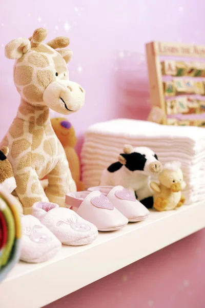 Stuffed toys, shoes and nappies — Stock Photo, Image