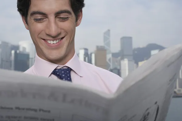 Businessman reading newspaper — Stock Photo, Image