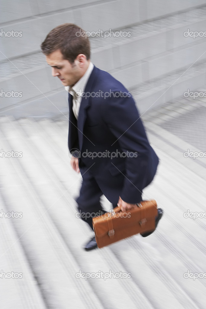 carrying a briefcase