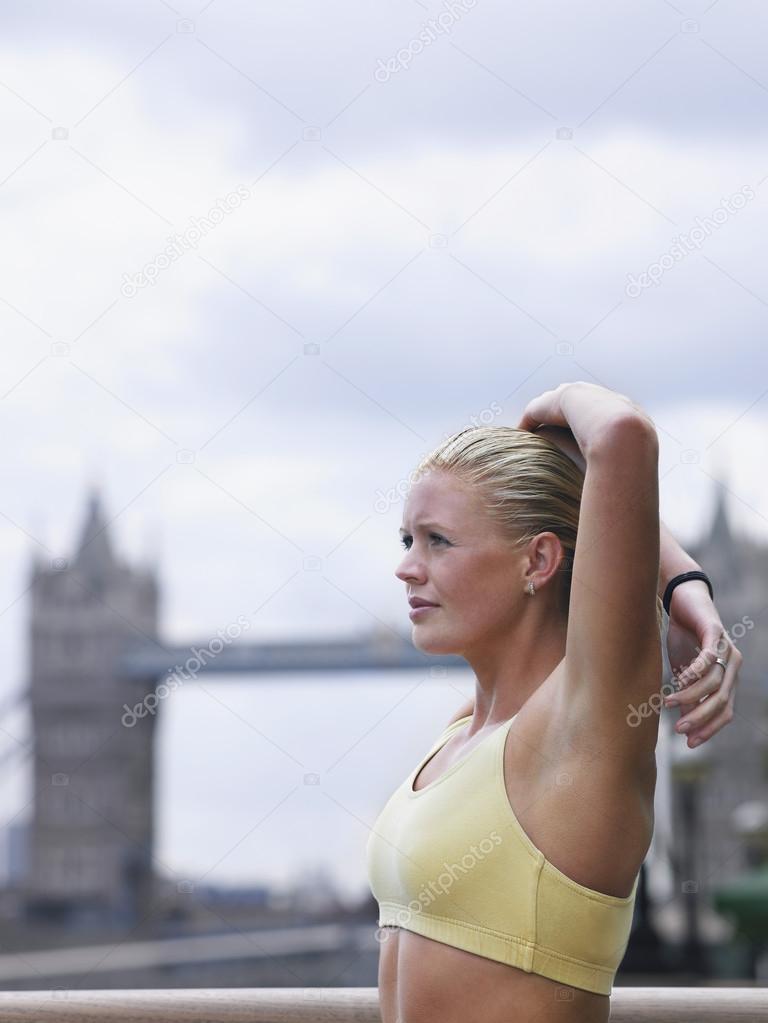 female Athlete Stretching